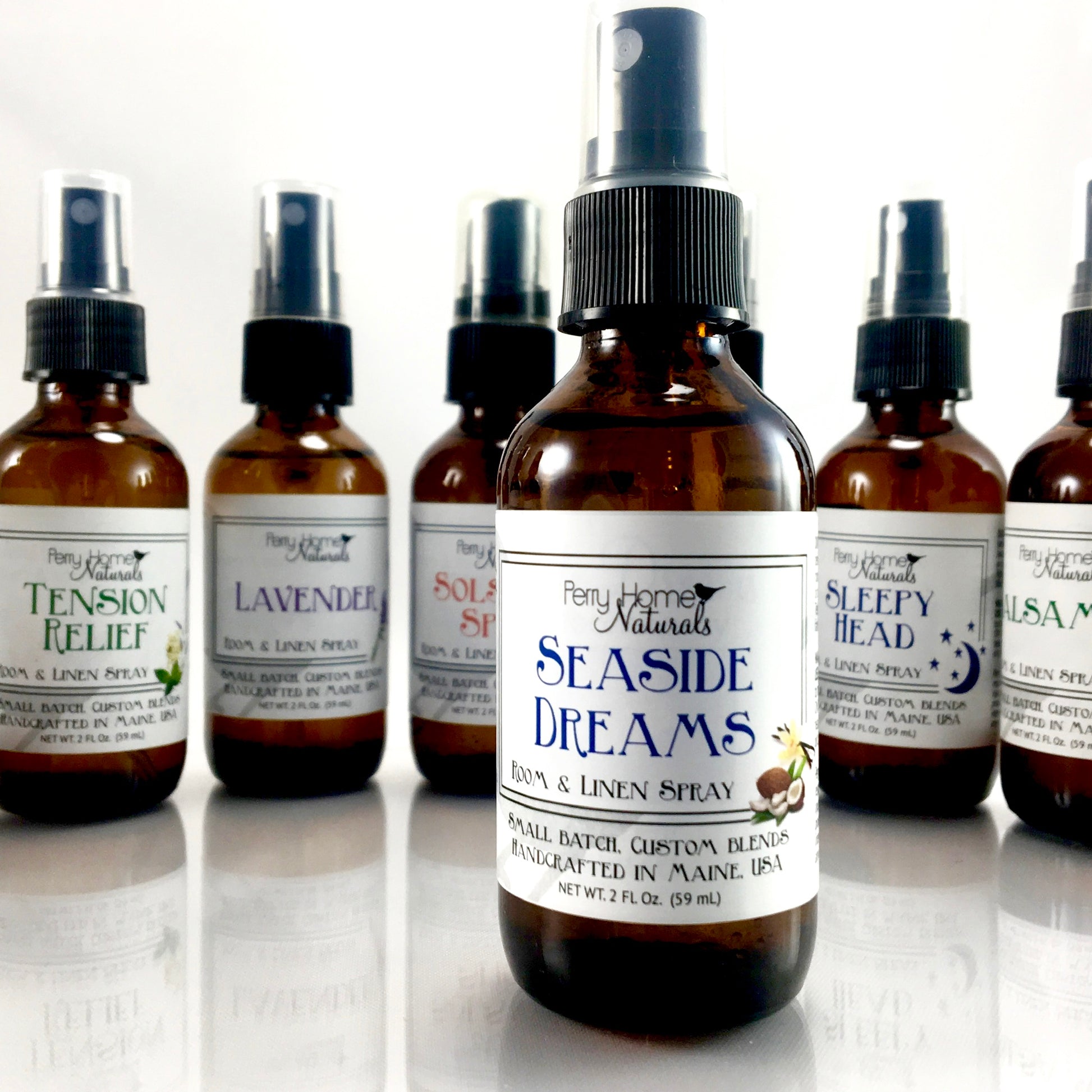 Seaside Dreams Room & Linen Spray by Perry Home Naturals. This is our lemongrass, coconut, vanilla, handcrafted room & linen spray. Beach scent any time of year! Use it on linens, around your home, and create a beachy atmosphere anytime!